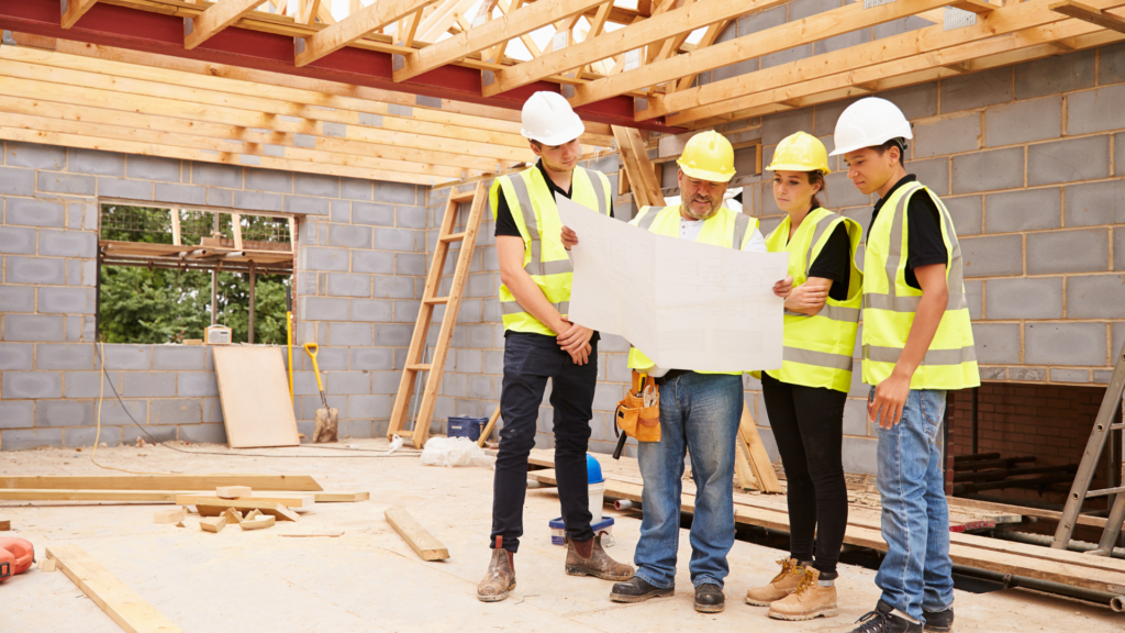 Builder measuring materials on a construction site for property development